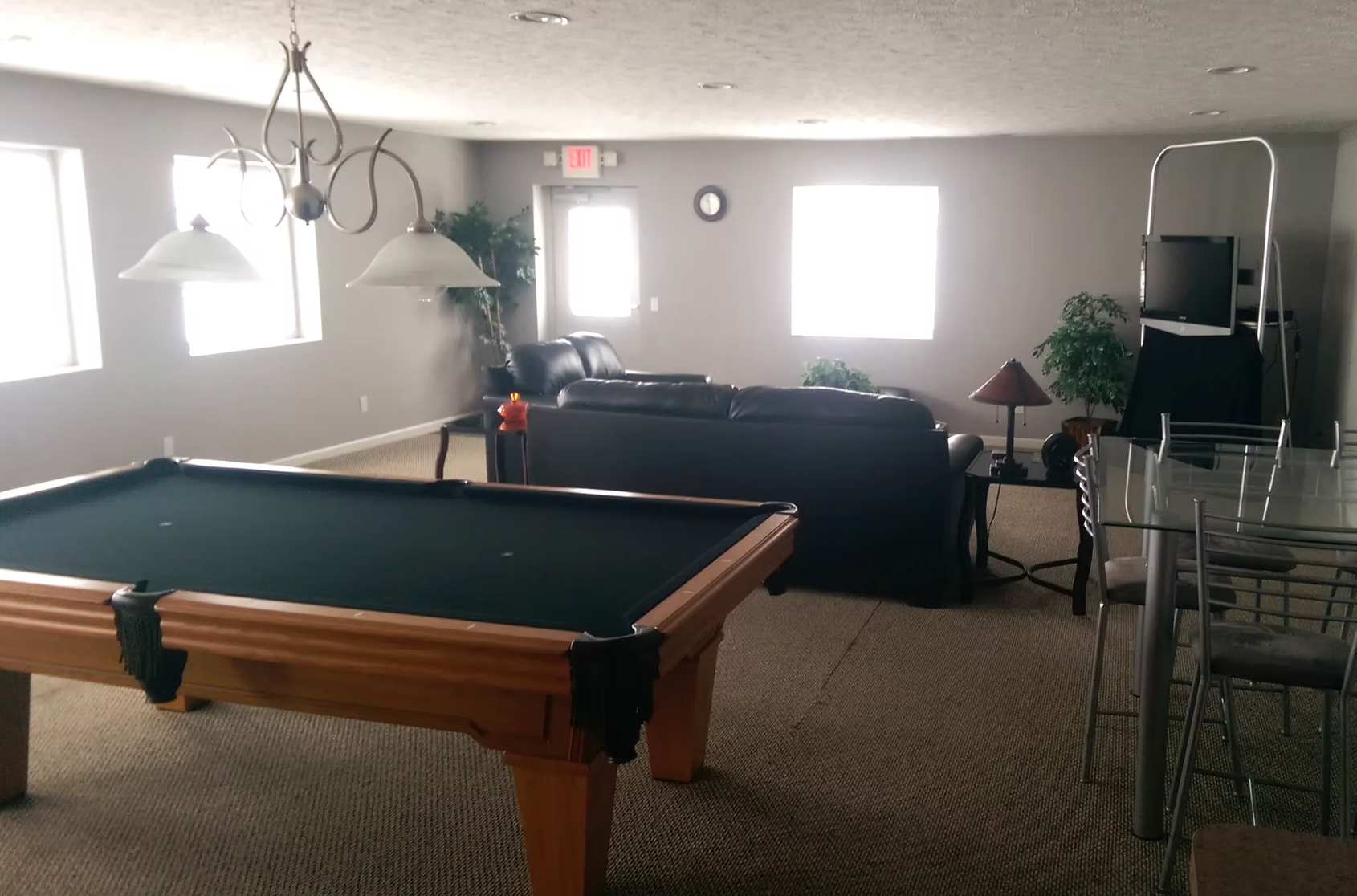 MRK Aviation pilot lounge with pool table, leather sofas, and dining area