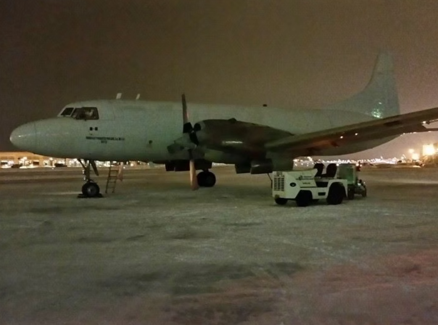 Cargo aircraft on the ramp at MRK Aviation at night in winter