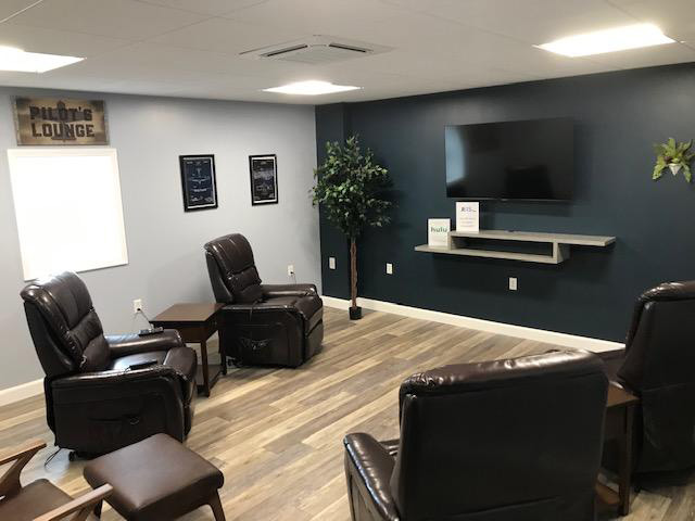 JETS FBO North pilots lounge with recliners and TV