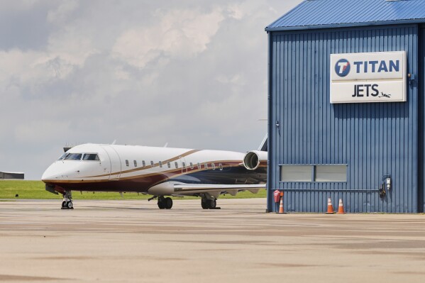Private jet on the ramp at JETS Youngstown with Titan and JETS signage